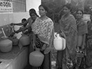 Happy villagers filling their containers with the first gush of drinking water from RO plant installed by…